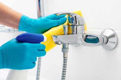 Cleaning technician applying safe product handling procedures on carpet